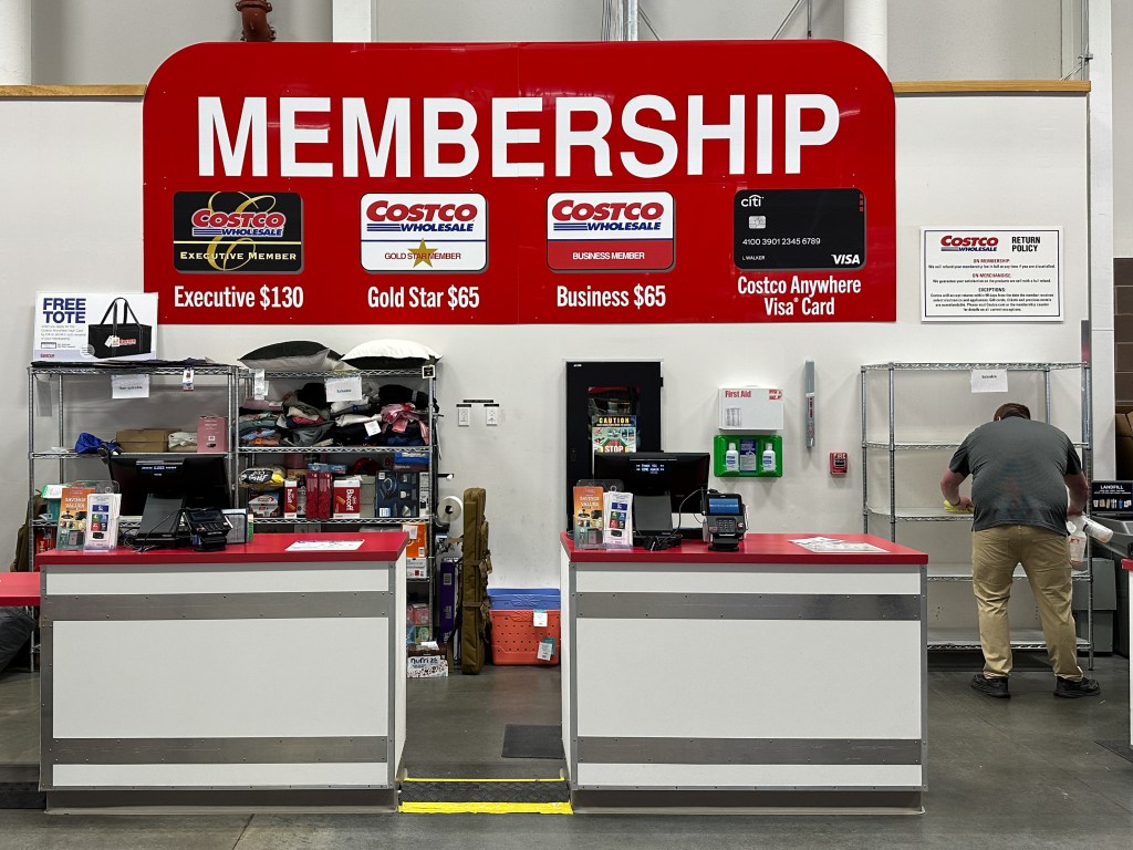 COSTCO membership counter with price information.